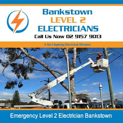 Emergency electrician in elevated work platform repairing power pole infrastructure in Bankstown