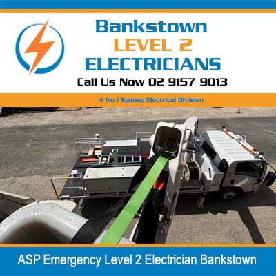 Emergency electrical service trucks and equipment set up on street in Bankstown