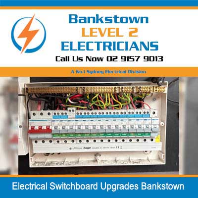 Open electrical switchboard upgrade showing rows of circuit breakers and colored wiring in Bankstown